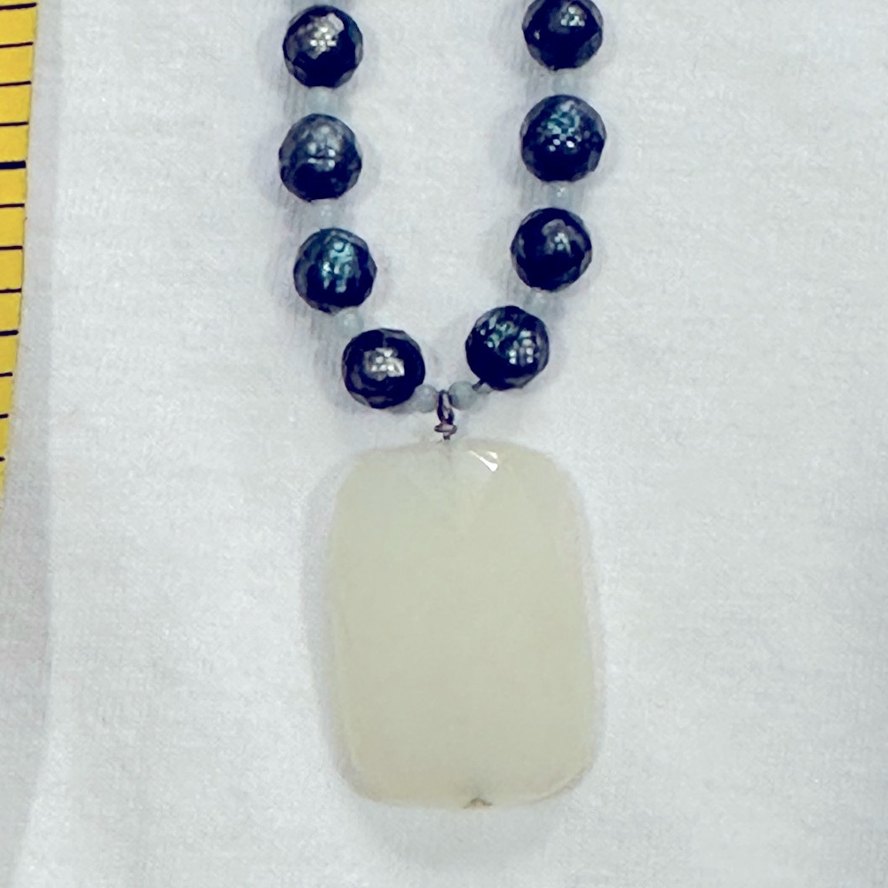 Handmade green beaded necklace with white pendant